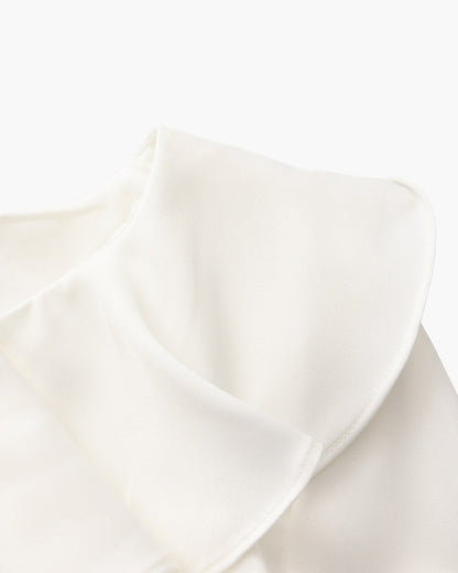 Vestido midi con volantes y botones de perla