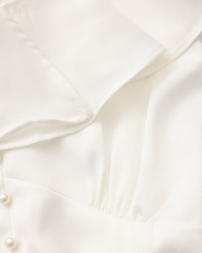 Vestido midi con volantes y botones de perla